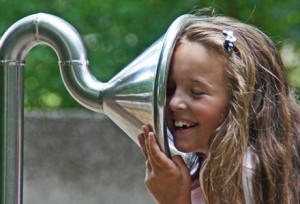 WordPress Notifications-Girl listening to playground ear trumpet
